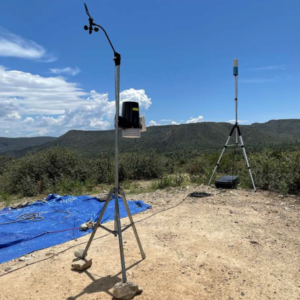 Two small tripods support meteorological equipment.